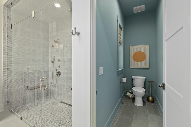 214 Pelican Reef Dr, Saint Augustine, FL 32080 - bathroom with a shower stall, visible vents, baseboards, toilet, and tile patterned floors