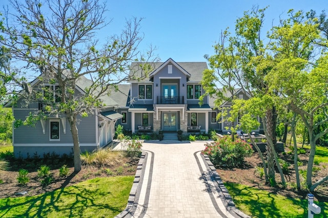 214 Pelican Reef Dr, Saint Augustine, FL 32080 - craftsman house featuring french doors and a balcony