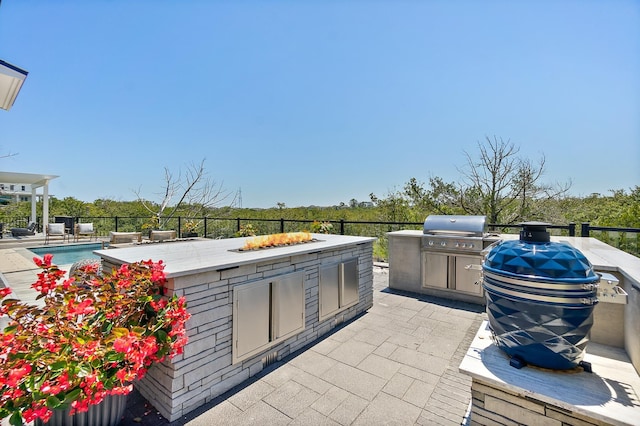 214 Pelican Reef Dr, Saint Augustine, FL 32080 - view of patio with area for grilling and an outdoor fire pit