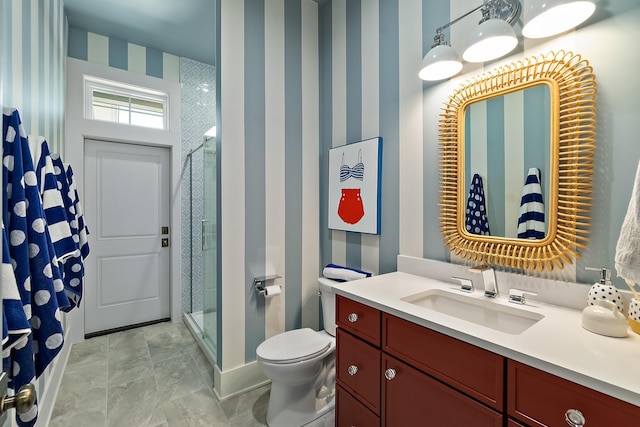 214 Pelican Reef Dr, Saint Augustine, FL 32080 - bathroom featuring wallpapered walls, vanity, toilet, and a stall shower