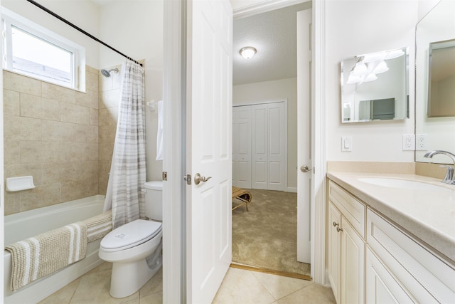 full bathroom featuring vanity, tile patterned floors, toilet, shower / bathtub combination with curtain, and a textured ceiling