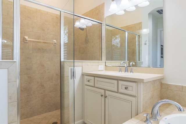 bathroom featuring separate shower and tub and vanity