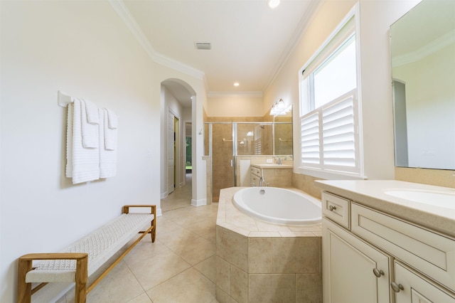 bathroom with tile patterned floors, vanity, shower with separate bathtub, and crown molding