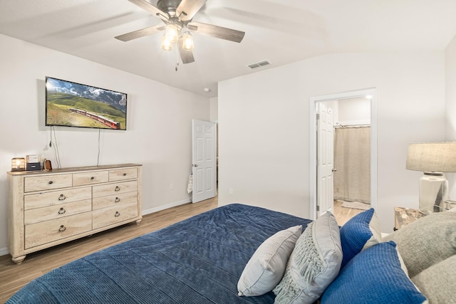 7503 Caravaca Ct, Jacksonville, FL 32244 - bedroom with wood finished floors, a ceiling fan, ensuite bath, and baseboards