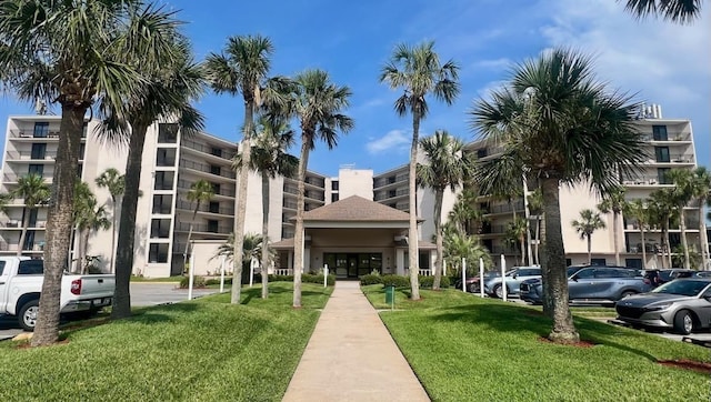 2 Dondanville Rd Unit 216, Saint Augustine Beach, FL 32080 - view of apartment building / complex featuring uncovered parking
