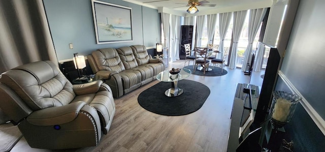 2 Dondanville Rd Unit 216, Saint Augustine Beach, FL 32080 - living area featuring ceiling fan, wood finished floors, ornamental molding, and baseboards