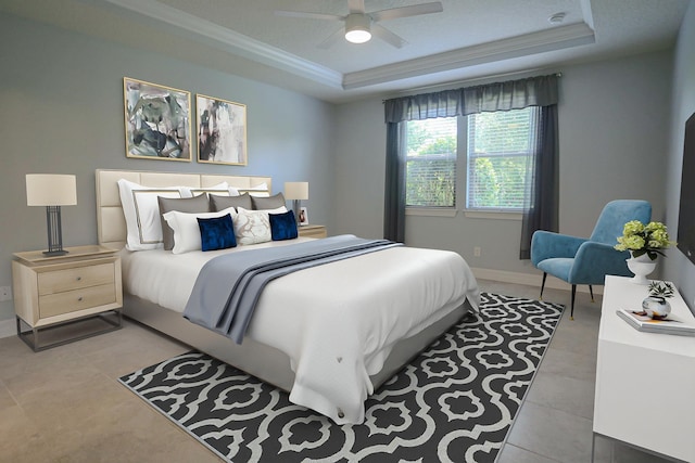 bedroom featuring a raised ceiling, ornamental molding, tile patterned flooring, and baseboards