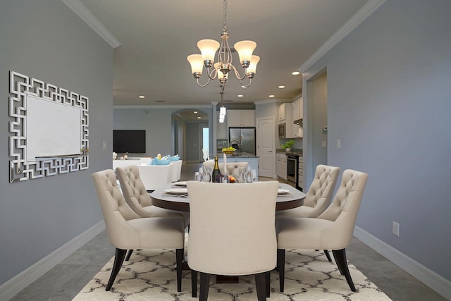 dining area featuring baseboards, recessed lighting, ornamental molding, and an inviting chandelier