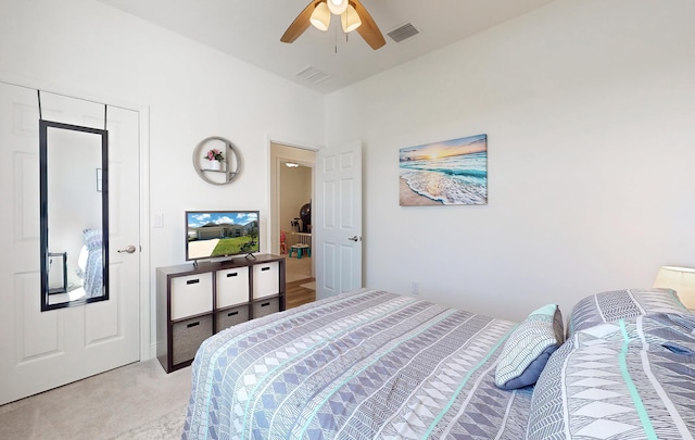 59 Oakleaf Way, Palm Coast, FL 32137 - bedroom with visible vents, a ceiling fan, and light carpet