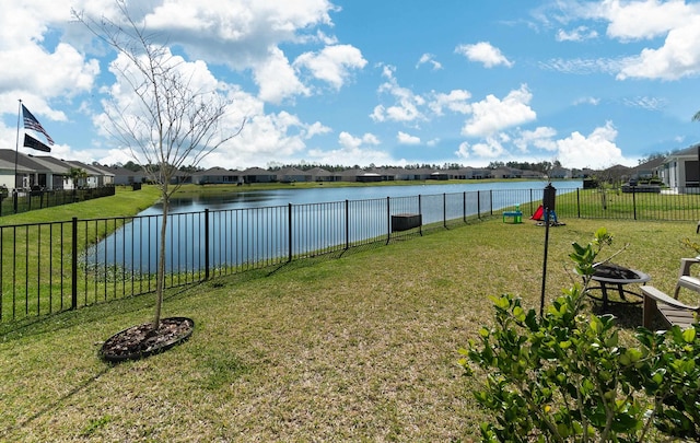 59 Oakleaf Way, Palm Coast, FL 32137 - view of yard with a fenced backyard, a water view, a fire pit, and a residential view