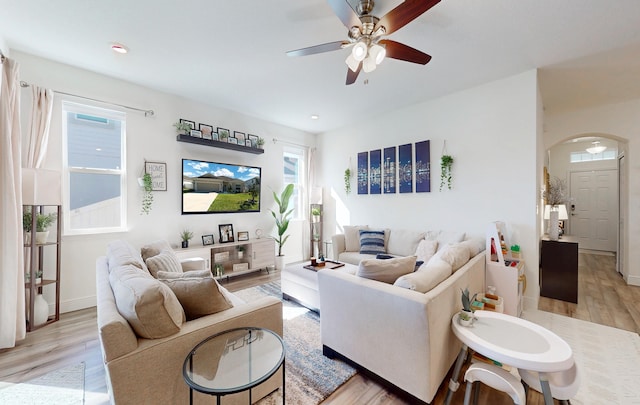 59 Oakleaf Way, Palm Coast, FL 32137 - living area with light wood-type flooring, baseboards, ceiling fan, arched walkways, and recessed lighting