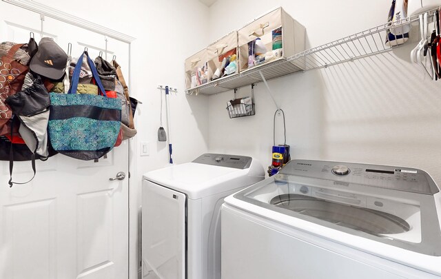 59 Oakleaf Way, Palm Coast, FL 32137 - laundry room with washer and dryer and laundry area