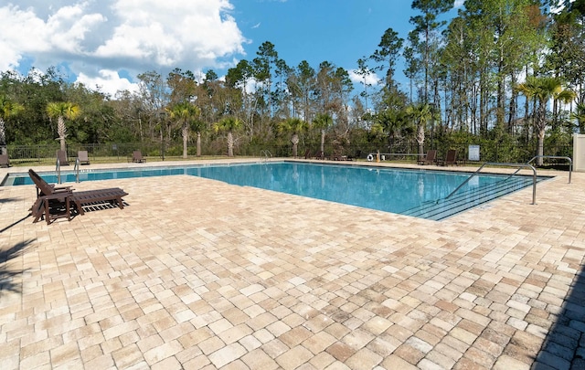 59 Oakleaf Way, Palm Coast, FL 32137 - community pool with a patio area and fence