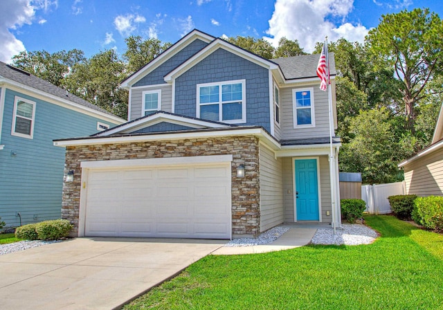 view of front of property featuring a garage and a front yard