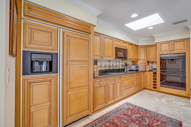 1 Sandpiper Cv, Ponte Vedra Beach, FL 32082 - kitchen featuring black appliances, a skylight, crown molding, tasteful backsplash, and dark stone counters