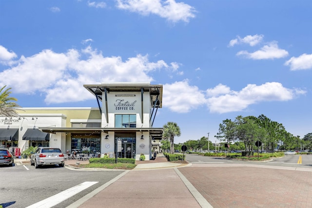 1 Sandpiper Cv, Ponte Vedra Beach, FL 32082 - view of asphalt road with sidewalks, traffic signs, curbs, and street lighting