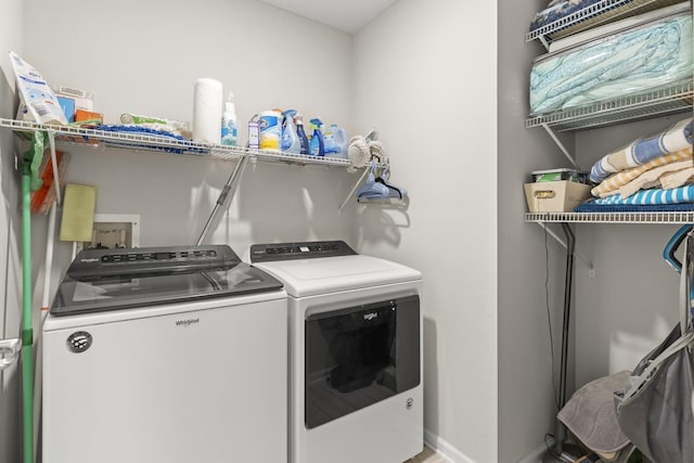 laundry room featuring washing machine and clothes dryer