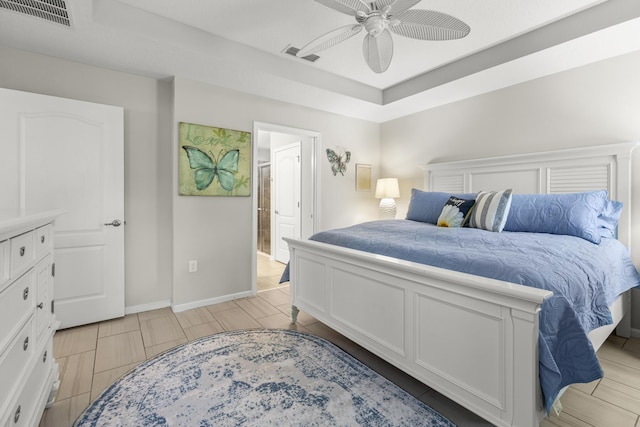 bedroom with connected bathroom and ceiling fan