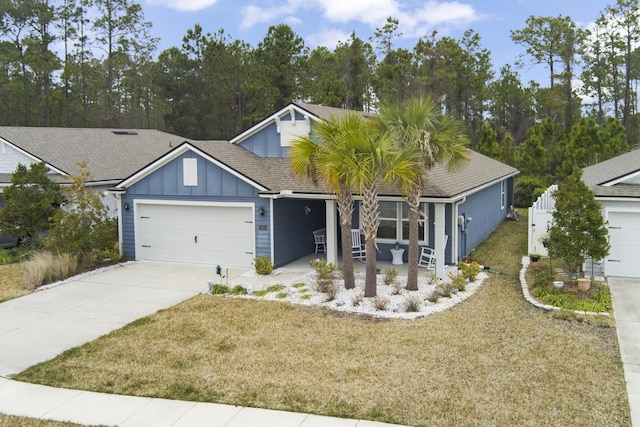 view of front of property with a garage and a front yard