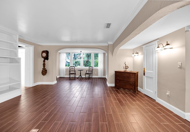 unfurnished living room with dark hardwood / wood-style floors and ornamental molding