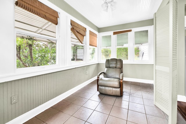 living area featuring tile patterned floors and plenty of natural light