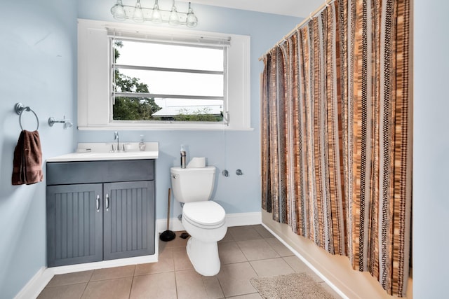 full bathroom featuring vanity, shower / tub combo with curtain, tile patterned flooring, and toilet