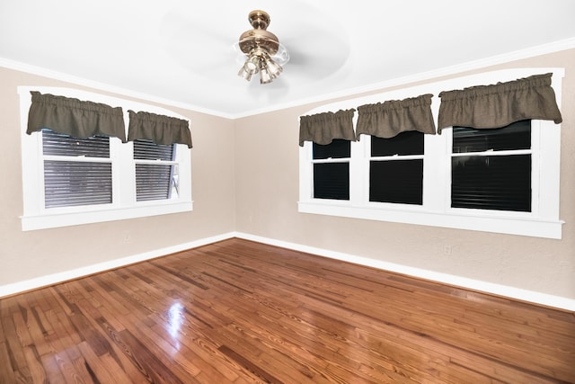 unfurnished room with hardwood / wood-style flooring, ceiling fan, and crown molding