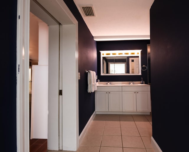 bathroom with vanity and tile patterned floors