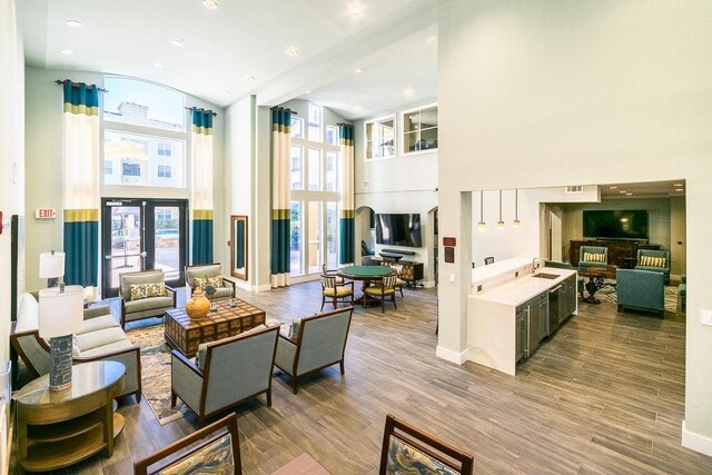 dining area with ornamental molding, dark hardwood / wood-style flooring, and a tray ceiling