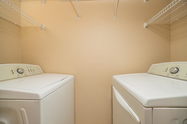 washroom featuring washer and dryer