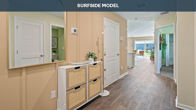 55 Rose Dr Unit B, Palm Coast, FL 32164 - corridor featuring dark hardwood / wood-style flooring and a textured ceiling