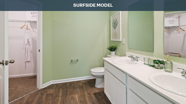 55 Rose Dr Unit B, Palm Coast, FL 32164 - bathroom with toilet, vanity, and hardwood / wood-style flooring