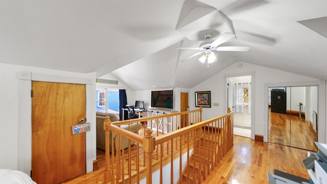 bonus room featuring hardwood / wood-style flooring, lofted ceiling, and ceiling fan