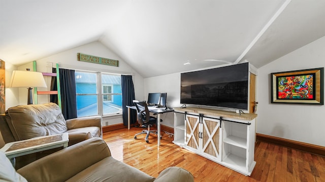 home office featuring hardwood / wood-style flooring and vaulted ceiling