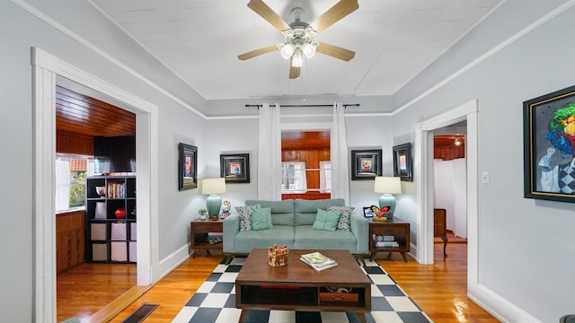 living room with ceiling fan and light wood-type flooring