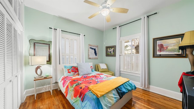 bedroom with hardwood / wood-style flooring and ceiling fan