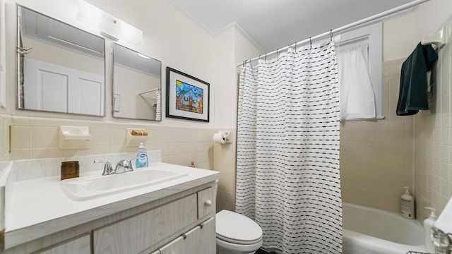 full bathroom featuring shower / bath combo, tile walls, vanity, ornamental molding, and toilet