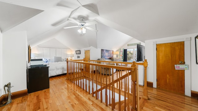 interior space with vaulted ceiling and light hardwood / wood-style floors