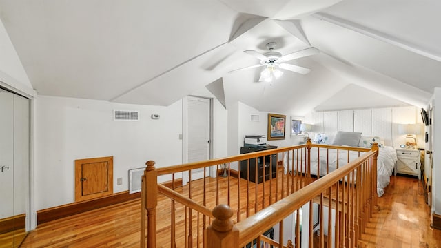 bonus room with ceiling fan, wood-type flooring, and vaulted ceiling