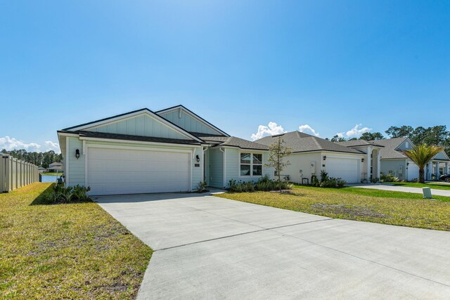 42 Huesca Ct, Saint Augustine, FL 32084 - ranch-style house with a garage, a front yard, driveway, and fence