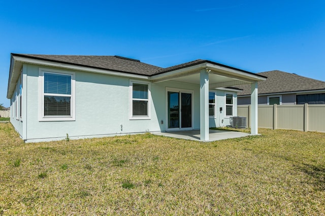 42 Huesca Ct, Saint Augustine, FL 32084 - back of property with a patio, central AC unit, fence, and a lawn