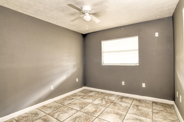 spare room with ceiling fan and a textured ceiling