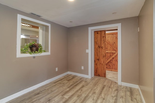 unfurnished room featuring light hardwood / wood-style flooring