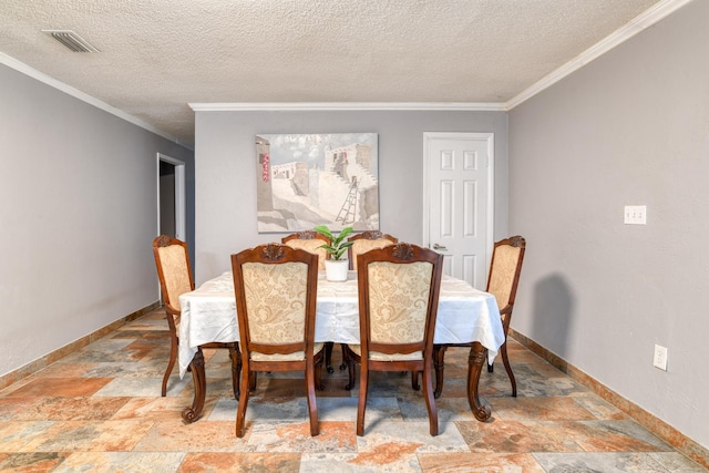 dining area featuring a textured ceiling and ornamental molding