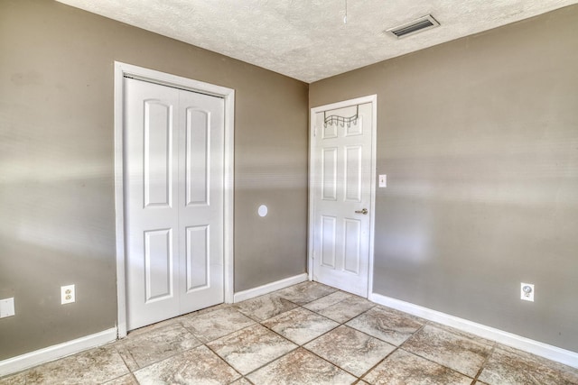 entrance foyer with a textured ceiling