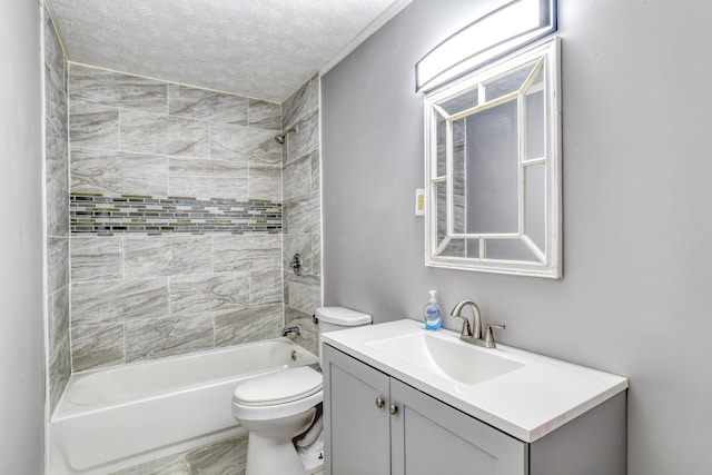 full bathroom with vanity, toilet, a textured ceiling, and tiled shower / bath