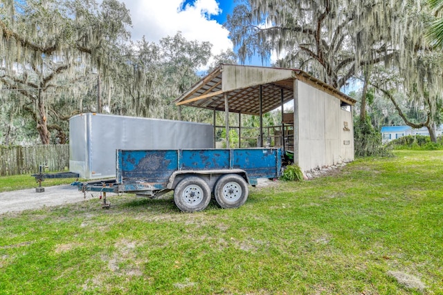 view of property exterior with a lawn and a carport