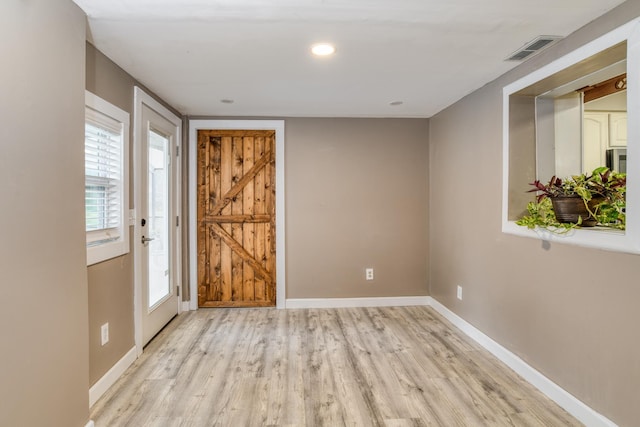 entryway with light hardwood / wood-style floors