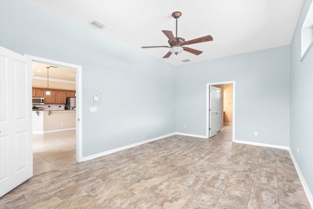 spare room with ceiling fan