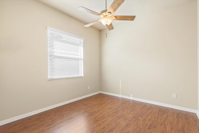 empty room featuring hardwood / wood-style floors and ceiling fan